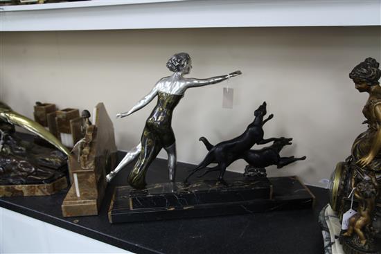 Uriano. A French Art Deco patinated bronzed spelter group of a lady and two running hounds, width 28in.